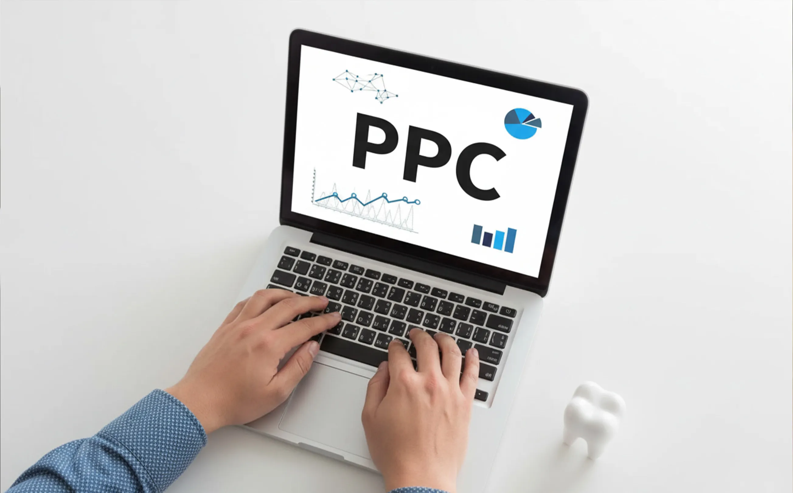 Dentist reviewing PPC performance on a laptop, pausing and scaling Google Ads budgets while analyzing dental patient leads