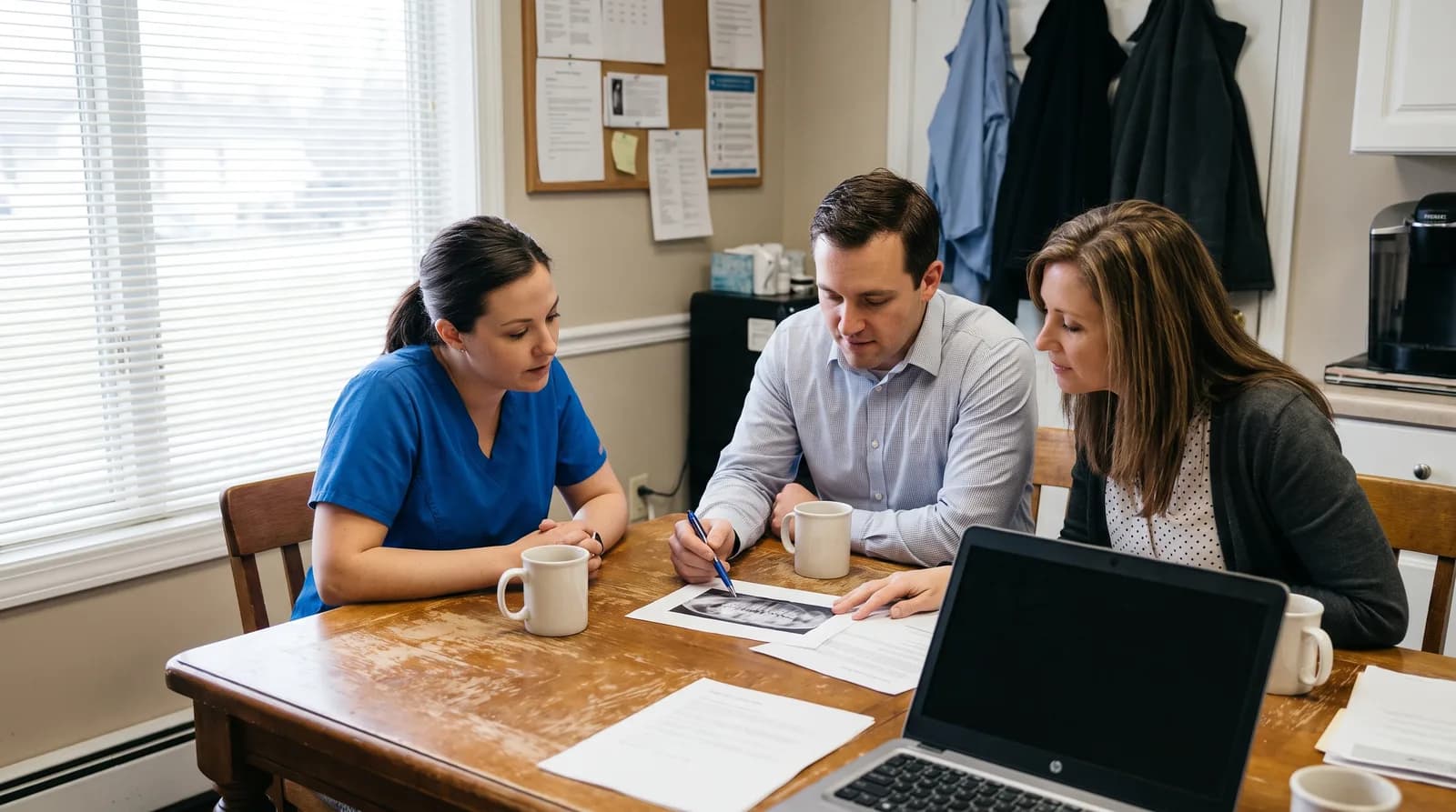 Dental practice owner reviewing a production goal calculation on a whiteboard with provider hours and case mix inputs